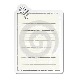 A creative distressed sticker of a cartoon lined paper with paperclip