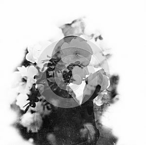 Delicate double exposure portrait of a young woman