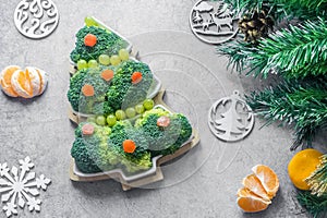 Creative edible Christmas tree made of fresh broccoli.Holiday ideas. New year food background top view . holiday, celebration,