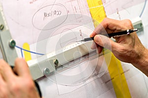 Architect working on drawing board