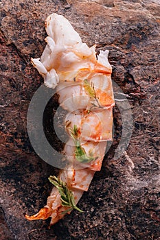 Creative Fine Dining: Grilled lobster and grilled corn served in natural stone form plate