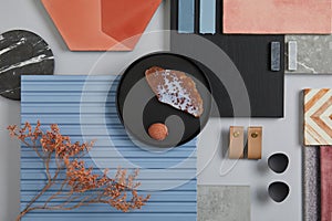 Creative flat lay composition of interior designer mood board with textile and paint samples, blue lamella panels and tiles. photo