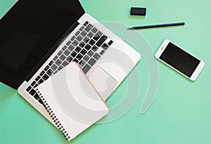 Creative flat lay design of workspace desk with laptop