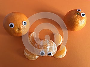 Creative fruit concept, googly eyed oranges
