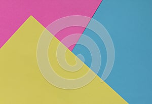 Creative geometric paper background. Pink, blue, yellow colors.