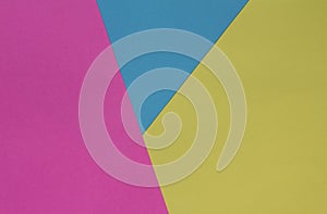 Creative geometric paper background. Pink, blue, yellow colors.