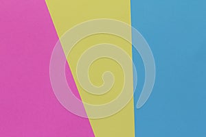 Creative geometric paper background. Pink, blue, yellow colors.