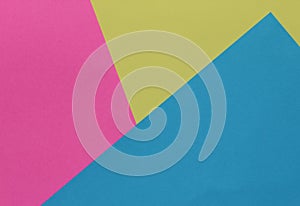 Creative geometric paper background. Pink, blue, yellow colors.