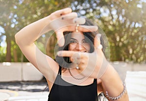 Creative girl and portrait with hand frame for inspiration, idea and happiness in sunshine at park. Youth, trendy and