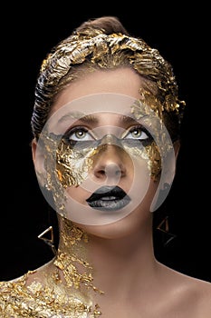 Creative golden makeup on black background