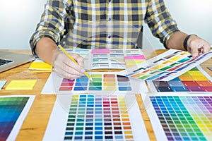 Creative Graphic designer at work. Color swatch samples pantone