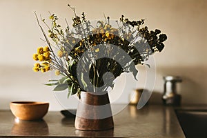 Creative greeting flower bouquet with blossoms design. Beautiful flowering plant abloom flowerpot vase home decoration. photo