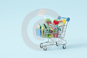 Creative Halloween sopping cart.concept many sweets for children in one place, a delicious junk snack. Flat lay, pastel blue