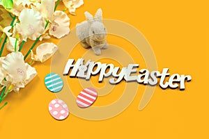 Creative happy easter greeting card in flat lay style with easter bunny and text message
