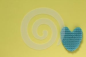 Creative heart from an edible wafer in blue pastel color. Abstr