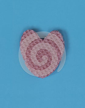Creative heart from an edible wafer in pastel pink and blue colo