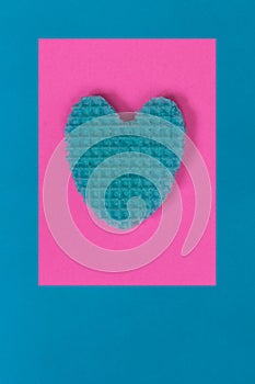 Creative heart from an edible wafer in pastel pink and blue colo