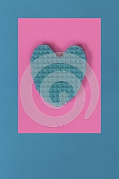 Creative heart from an edible wafer in pastel pink and blue colo