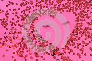 A creative heart made of small hearts with eyelashes. The concept of Valentine`s Day