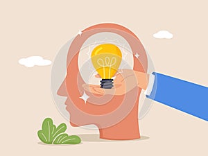 Creative idea concept. Creative mind or brainstorm. Abstract human head silhouette and hand holding bulb lamp. Modern