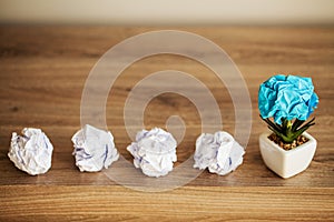 Creative idea concept.Inspiration, New idea and Innovation concept with Crumpled Paper on wood background