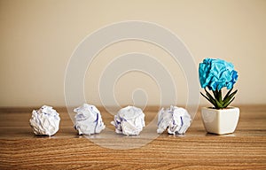 Creative idea concept.Inspiration, New idea and Innovation concept with Crumpled Paper on wood background