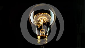 Creative idea concept light bulb with glowing brain filament against black background with copy space