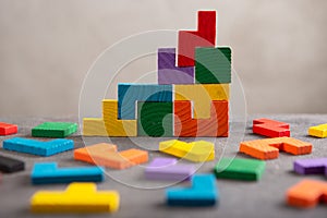 Creative idea solution - business concept, jigsaw puzzle on the grey background. Leadership and teamwork strategy success