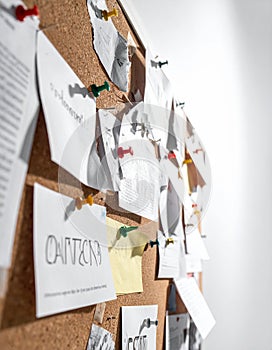 Creative Ideas and Notes Pinned to an Office Corkboard