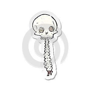 retro distressed sticker of a spooky cartoon sull and spine photo
