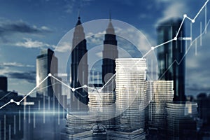 Creative image of stacked coins and business chart on blurry city background. Finance, economic growth and trade concept. Double
