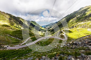 Creative image, view on Transfagarasan road. Till shift effect Travel background. Highway in european mountains. Europe,Romania.