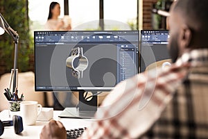 Creative innovator developing 3D model using CAD software