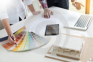 Creative or Interior designers teamwork with pantone swatch and