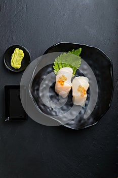 Creative Japanese food.Scallop Sushi on oba  leaf