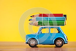 Creative Journey: Miniature Car Carrying Colored Pencils for Education and Art