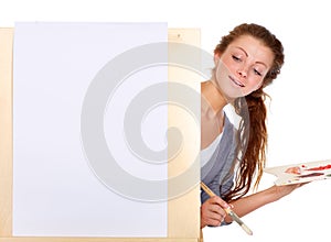 The creative juices are about to flow...Studio shot of a young woman holding a palette and brush and standing with an