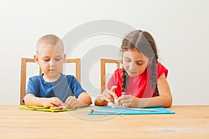 Creative kids molding at the table home