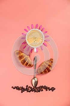 Creative layout made of coffee cup, croissants, coffee beans and