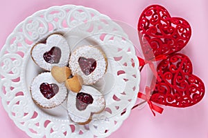 Creative layout made with heart shaped decoration and lovely  linzer cookies for Happy Valetine`s day