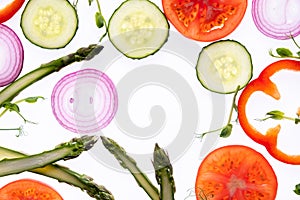 Creative layout pattern made of tomato slice, onion, cucumber, asparagus,  microgreen, pepperÑŽ Flat lay. Food concept.