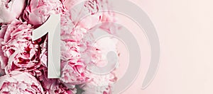 Creative layout. Pink peony flowers and digit one 1. Birthday greeting card. Anniversary concept. Top view. Copy space. Stylish