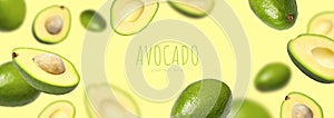 Creative layout with ripe flying avocado halves on yellow background. Healthy food, diet, tropical exotic fruit, trendy food