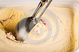 Creative look for some raspberry ripple ice cream being scooped up