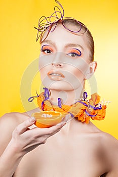 Creative make-up and hairstyle. Portrait of young girl