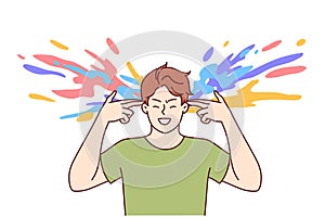 Creative man makes gesture of gun near head and colorful splashes, for concept of brainstorming