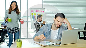 Creative man struggle with laptop computer, Frustrated man looking at computer while working at office, Business people struggle