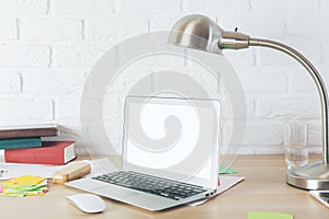 Modern desktop with empty laptop display