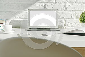 Creative modern desktop with white laptop