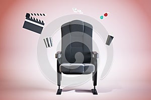 Creative movie theater armchair with pop corn, drinks and other items scattered around on pink background. Movies and cinema